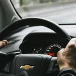 Senior driving his car