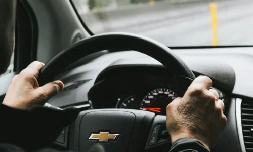 Senior driving his car