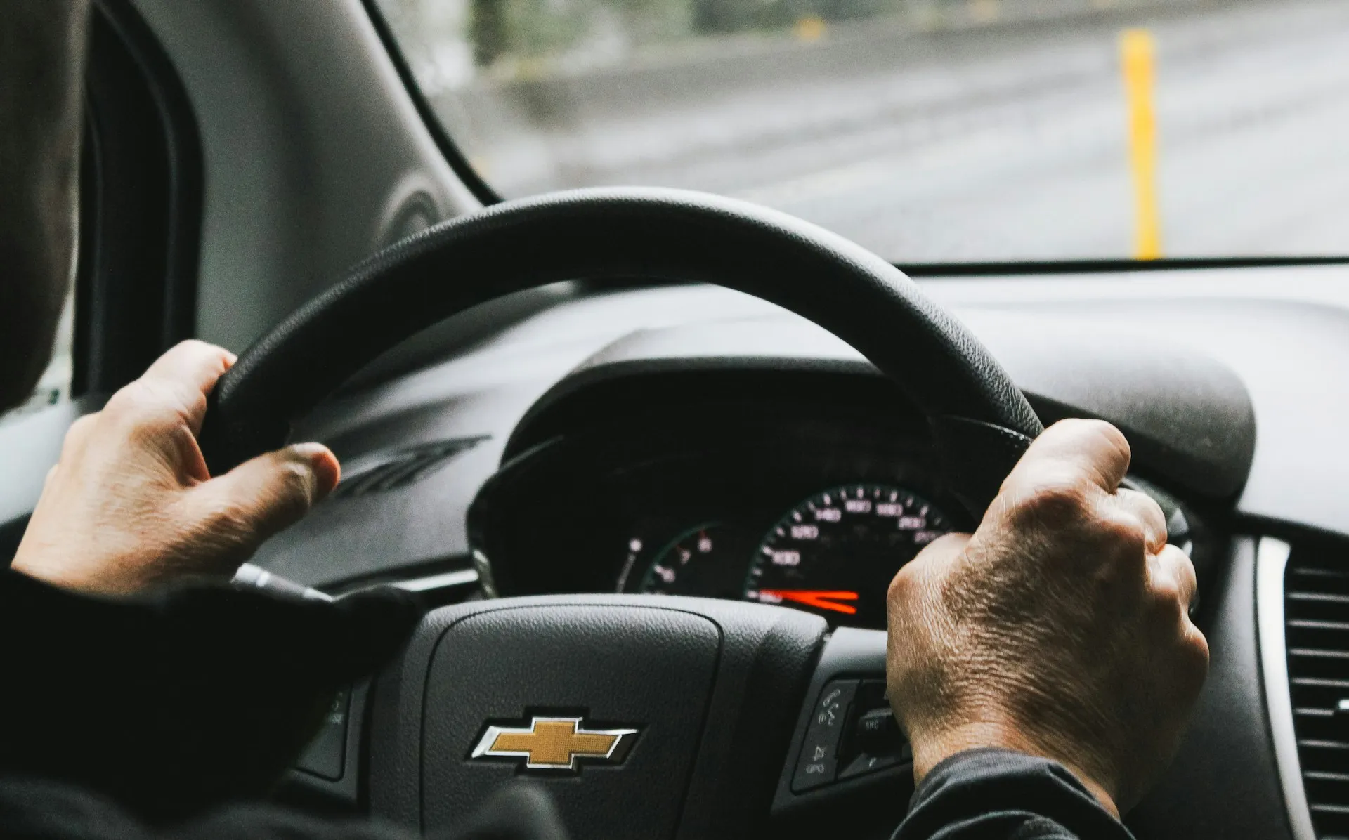 Senior driving his car